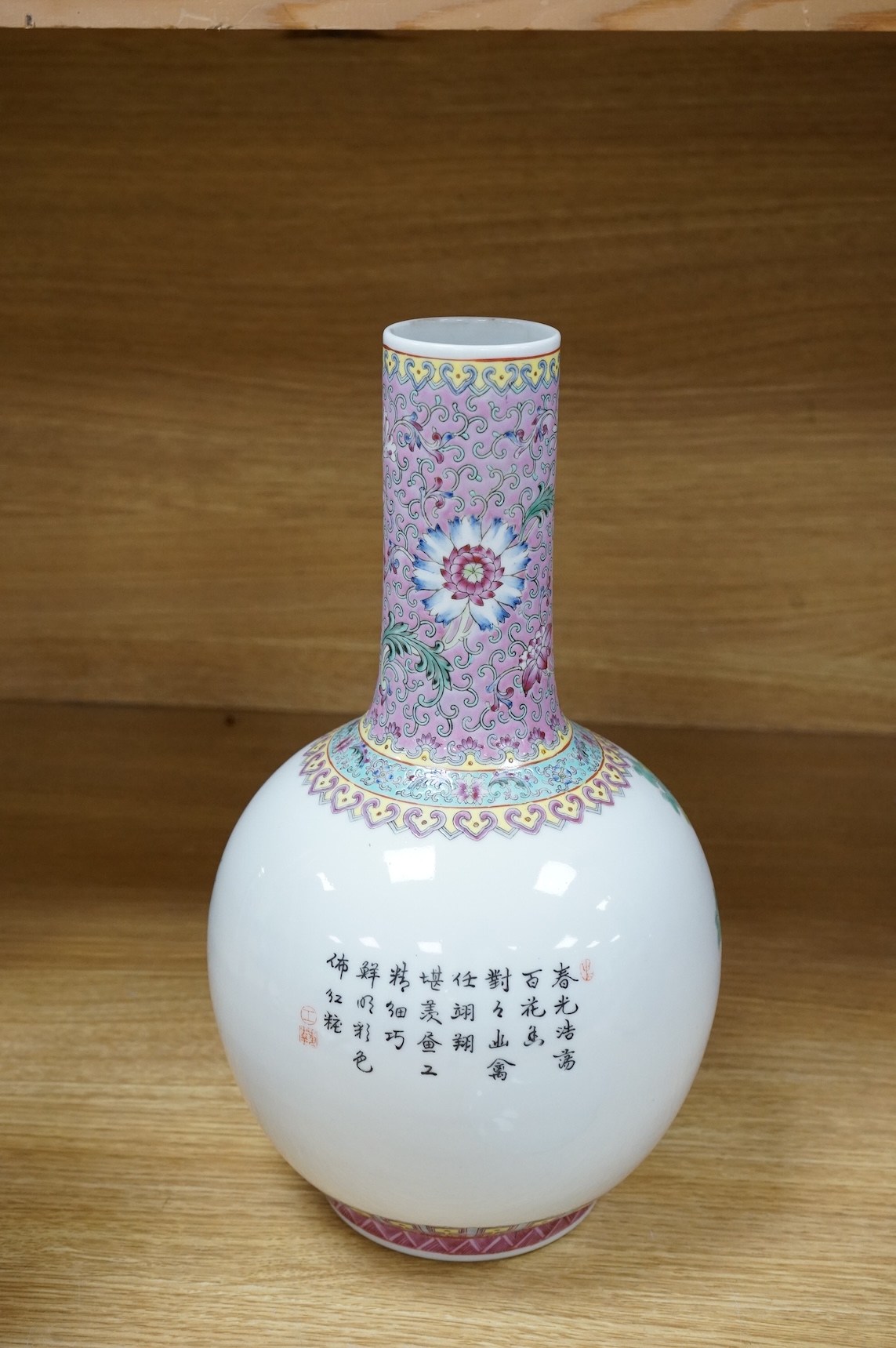 A Chinese famille rose vase, mid 20th century and a Chinese blue and white ‘boys’ dish, c.1900, vase 33cm high